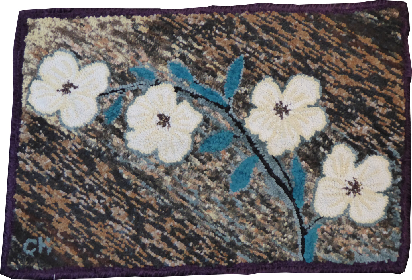 “Dogwood Flowers” – hand-hooked rug by Carmen Hall featuring creamy white dogwood blooms with teal leaves on a textured brown background, crafted from recycled fleece.

