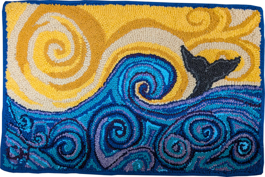 “Whale Tail” – hand-hooked rug by Carmen Hall featuring a stylized black whale tail above swirling blue waves under a golden spiral sky, crafted from assorted recycled fabrics.

