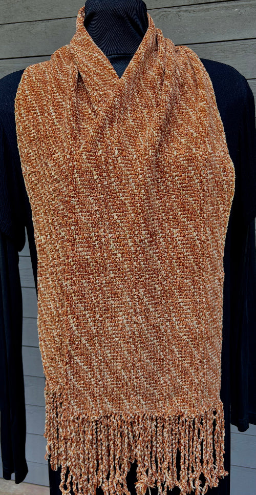 Orange and beige handwoven rayon chenille scarf with fringe, by Quadra Island fibre artist Vyvyan Dorsett. Soft, drapey, and luxurious.