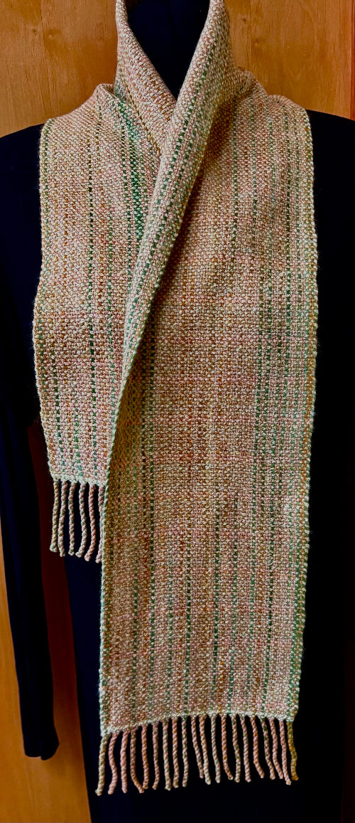 Variegated beige and green merino wool scarf, handcrafted by Vyvyan Dorsett on Quadra Island, with fringe